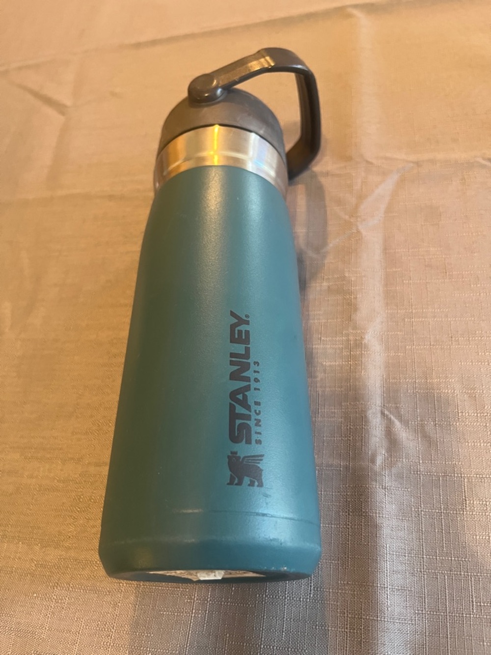 Stanley Teal Green Stainless Steel Travel Bottle with Dark Gray Handle